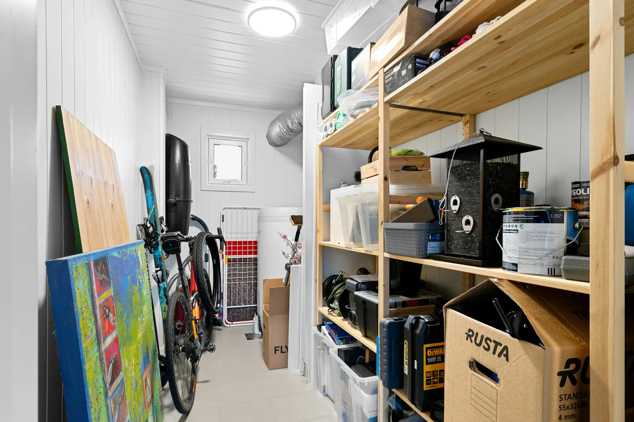 Boxes and household belongings arranged on storage shelves